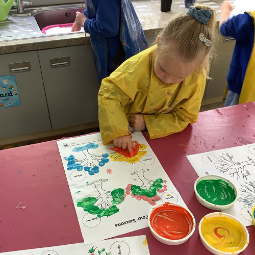 Student at St Wilfrids learning art through finger painting