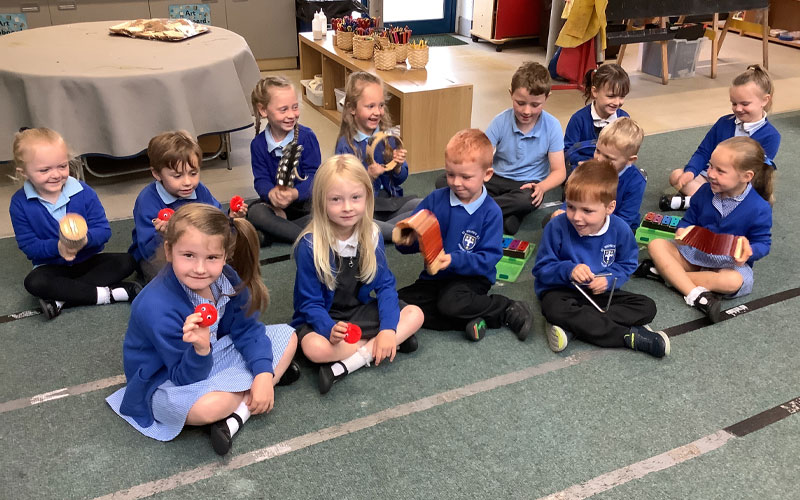 Students at St Wilfrids using percussion instruments and playing together in music class