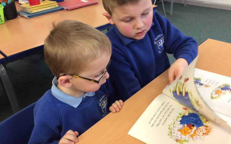 Students at St Wilfrids reading together in english class